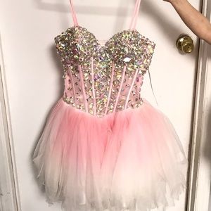Embellished light pink corset style prom dress.